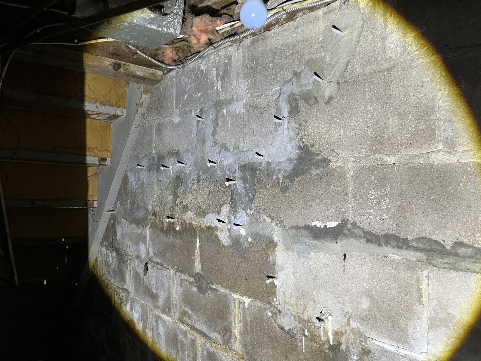 Epoxy injection ports along a horizontal foundation crack found during a home inspection in Vanier, Ottawa