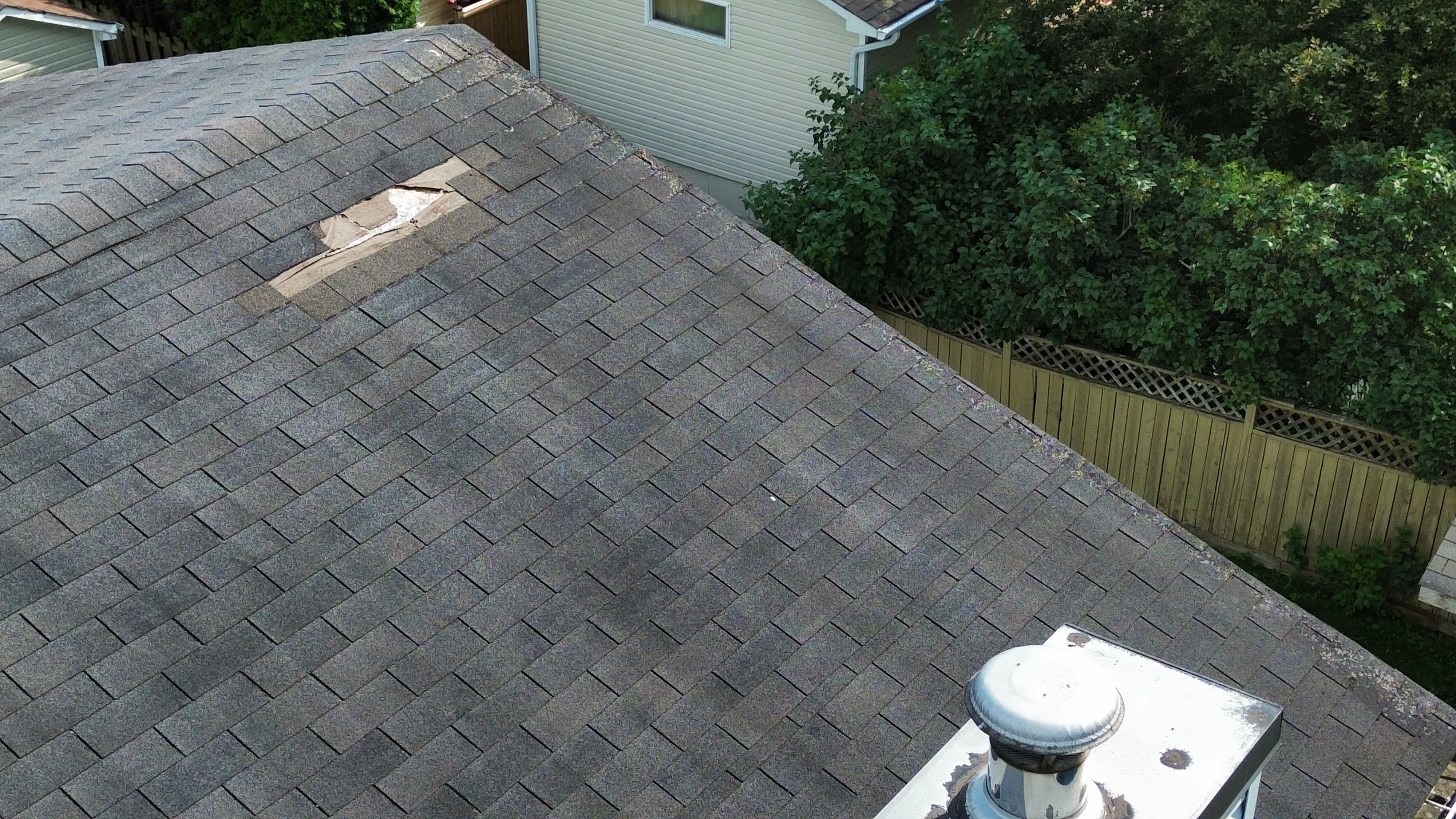 Aerial drone photo showing a missing shingle patch on a residential roof during a home inspection in Orléans, Ottawa