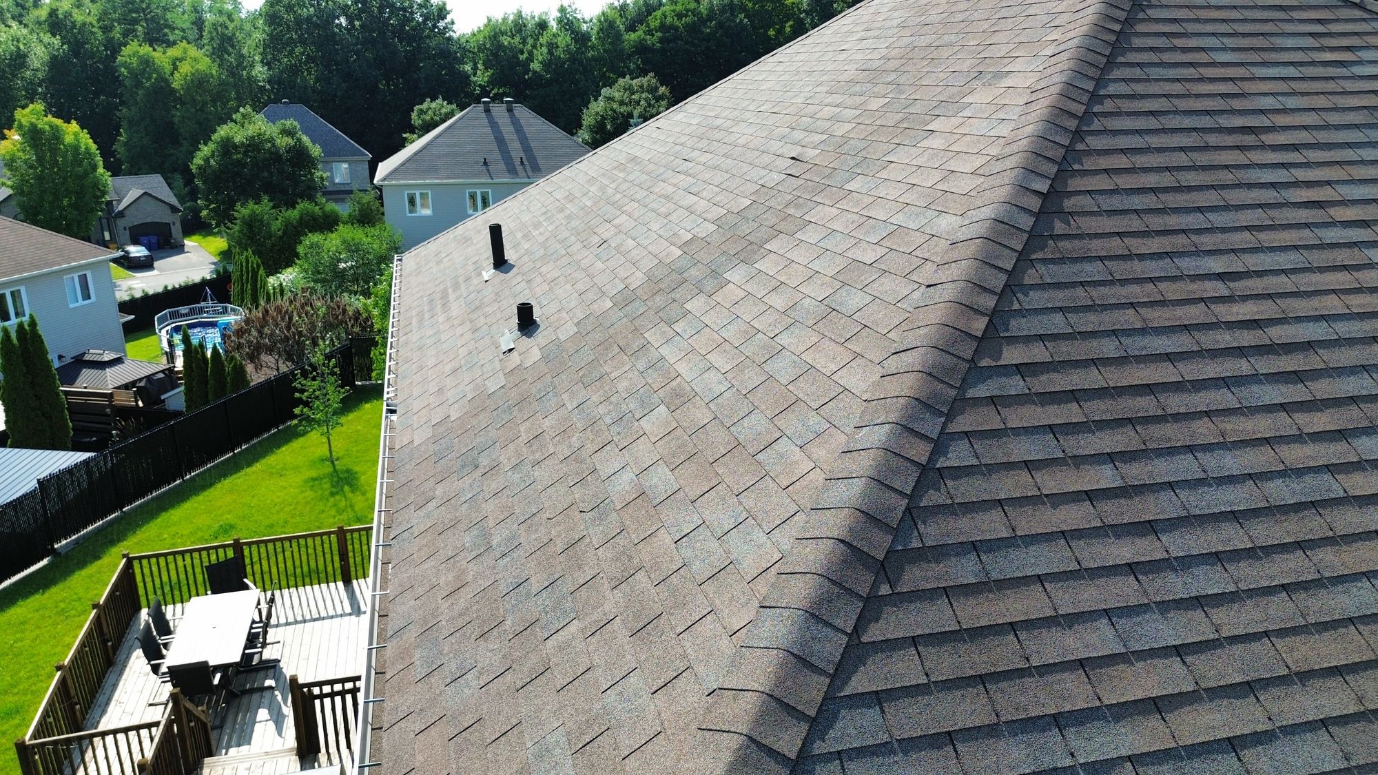 Aerial view of a Nepean roof showing an area of previous shingle repair found during a home inspection